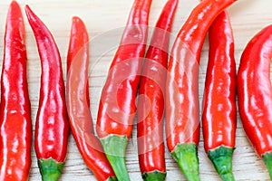 Red Chillis on wooden top