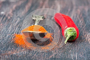 Red chilly peppers on a wooden table