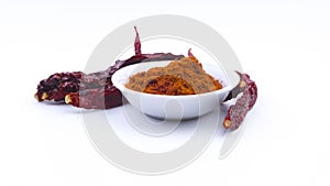 Red Chilly Powder in a bowl on white background.Selective focus and crop fragment.