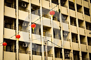 Red chinese lampions in front of residential buildings