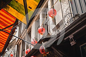 Red Chinese Lanterns above Awnings