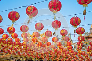 Red chinese lanterns hanging on wire outdoor lamps in temple of China Town decoration on Chinese New Year festival culture with