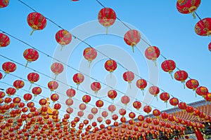 Red chinese lanterns hanging on wire outdoor lamps in temple of China Town decoration on Chinese New Year festival culture with