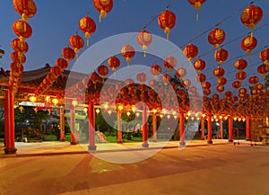 Red chinese lanterns hanging on wire outdoor lamps in temple of China Town decoration on Chinese New Year festival culture with