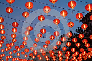 Red chinese lanterns hanging on wire outdoor lamps in temple of China Town decoration on Chinese New Year festival culture with