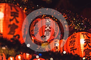 Red Chinese lanternTranslation Hieroglyph text Happy New Year hanging in a row during day time for Chinese new year celebration