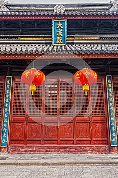 Red Chinese paper lanterns and wooden doors