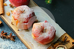 Red christmas apples stuffed with dried fruits in honey