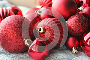 Red Christmas background, bunch of balls for Christmas tree close up, Christmas decorations. Christmas card, and new year, congrat