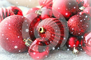 Red Christmas background, bunch of balls for Christmas tree close up, Christmas decorations. Christmas card, and new year, congrat