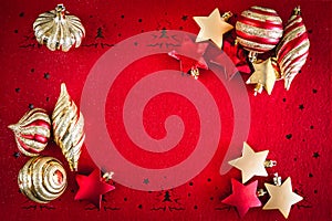 Red Christmas background with Gold Stars and Ribbon Decorations, with Copy Space for your Text