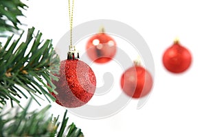 Red Christmas ball hanging on Christmas tree