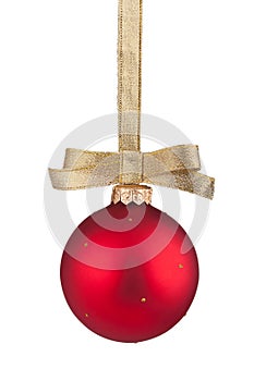 Red Christmas ball hanging on golden ribbon