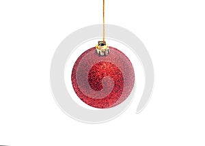 Red Christmas ball hanging on ribbon isolated on white background