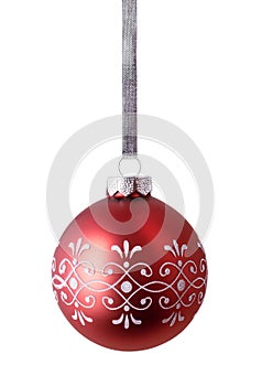 Red christmas ball hanging on silver ribbon isolated over white background