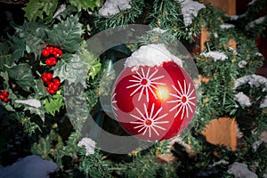 Red Christmas ball hanging on a tree