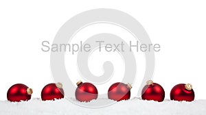 Red Christmas ball ornaments/baubles on white