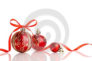 Red christmas ball with ribbon bow on white background