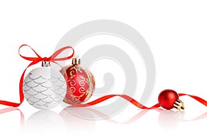Red christmas ball with ribbon bow on white background
