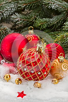 Red christmas ball under evergreen tree