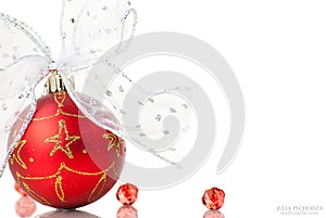 Red Christmas balls with bows on white
