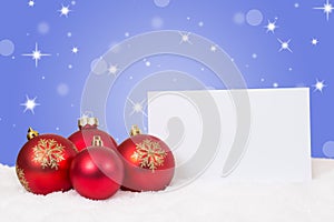 Red Christmas balls card for wishes with copyspace