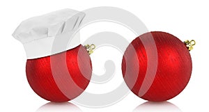 Red christmas balls and chef hat on white background