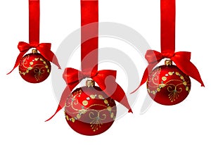 Red christmas balls with ribbon isolated on a white