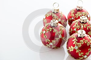 Red Christmas balls on white