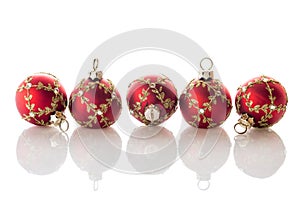 Red Christmas balls on white