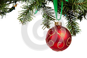 A red Christmas bauble hanging from garland