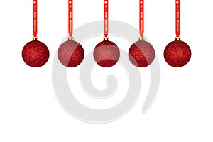 A red Christmas bauble hanging on a red ribbon, isolated on a white background with a clipping path and copy space, christmas deco
