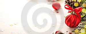Red Christmas bauble ornament with fir branches banner over white background, copy space