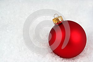 Red Christmas Bauble in the Snow