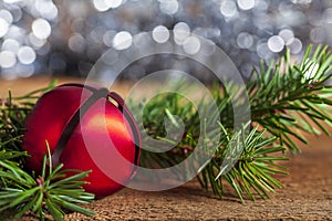 Red Christmas Bell with Pine Bough and Bokeh