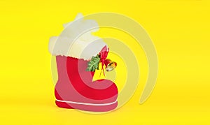 Red Christmas boot with gift on background