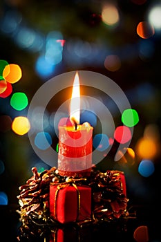 Red christmas candle in atmospheric light