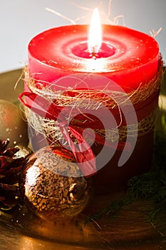 Red Christmas candle and Christmas ornaments