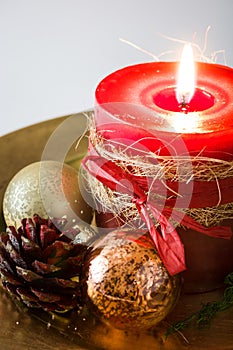 Red Christmas candle and Christmas ornaments