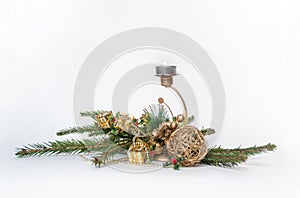 Red Christmas candle, decorated with fir branches, on a white background
