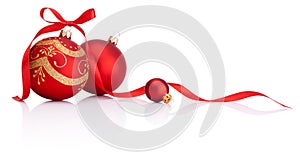 Red christmas decoration balls with ribbon bow on white