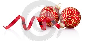 Red christmas decoration baubles and curling paper isolated