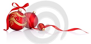Red christmas decoration baubles with ribbon bow isolated photo
