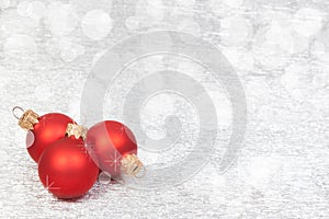 Red Christmas Decoration on a bokeh background with copyspace