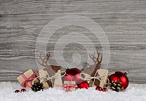 Red christmas decoration in country style with gift boxes, reind