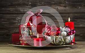Red christmas decoration on wooden background with carousel.