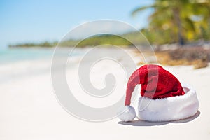 Red Christmas hat on the beach