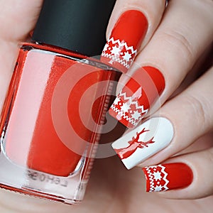 Red Christmas manicure with deer and Norwegian pattern