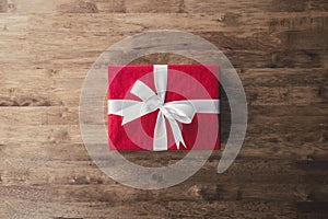 Red Christmas and New Year holidays gift box on wood table