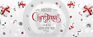 Red Christmas and New Year Text on Xmas background with flying gift boxes, red ribbon, decoration, sparkles, confetti, bokeh.